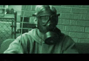 John Rasmussen, wearing a gas mask <img src="/cms/gfx/s51.gif" alt=":-)">">">">">